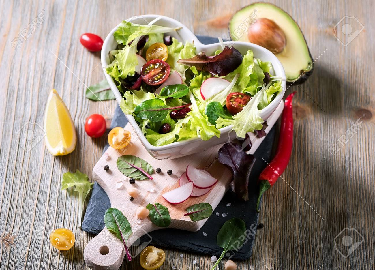Healthy green salad with avocado, mangold leaves, red beans and cherry tomatoes. Vegan snack, vitamins, vegetarian food and diet concept - 74119582 Healthy green salad with avocado, mangold leaves, red beans and cherry tomatoes. Vegan snack, vitamins, vegetarian food and diet concept - 74119582