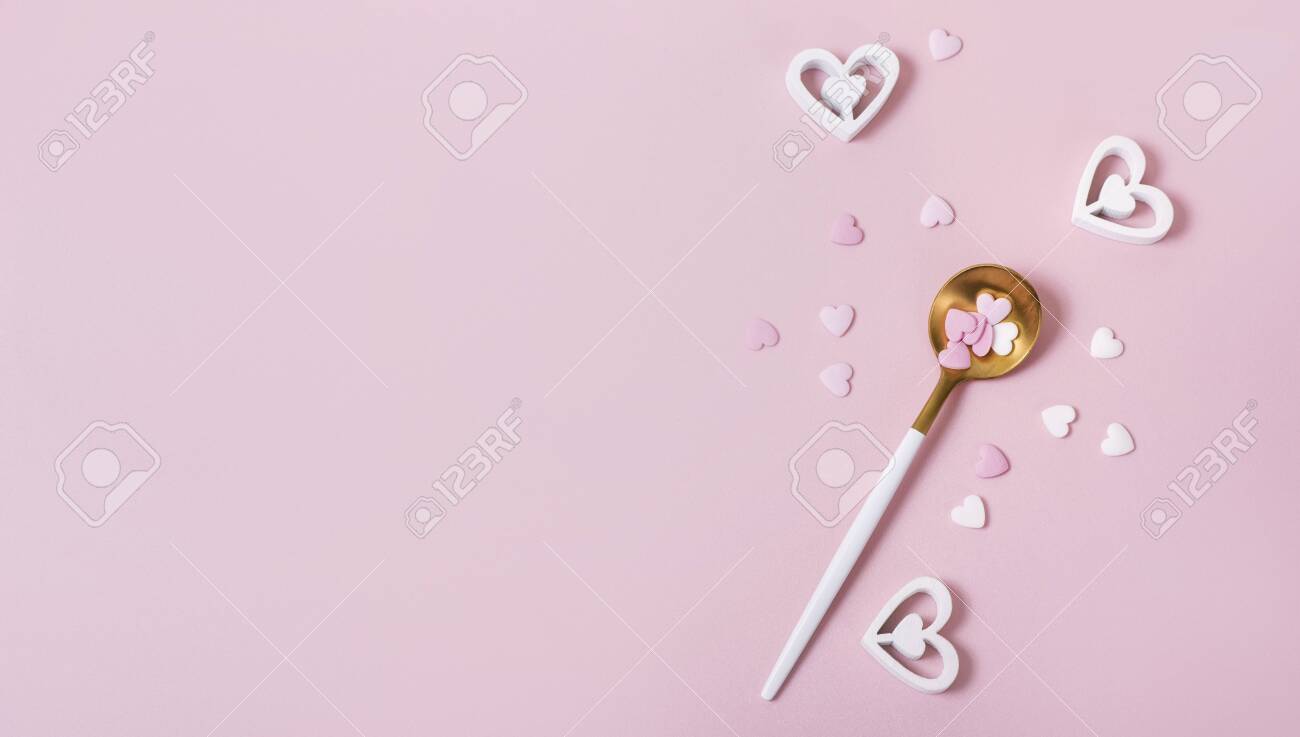 Spoon with hearts, pink romantic background, love symbols, top view, copy space for text, romantic eating concept - 141251661 Spoon with hearts, pink romantic background, love symbols, top view, copy space for text, romantic eating concept - 141251661