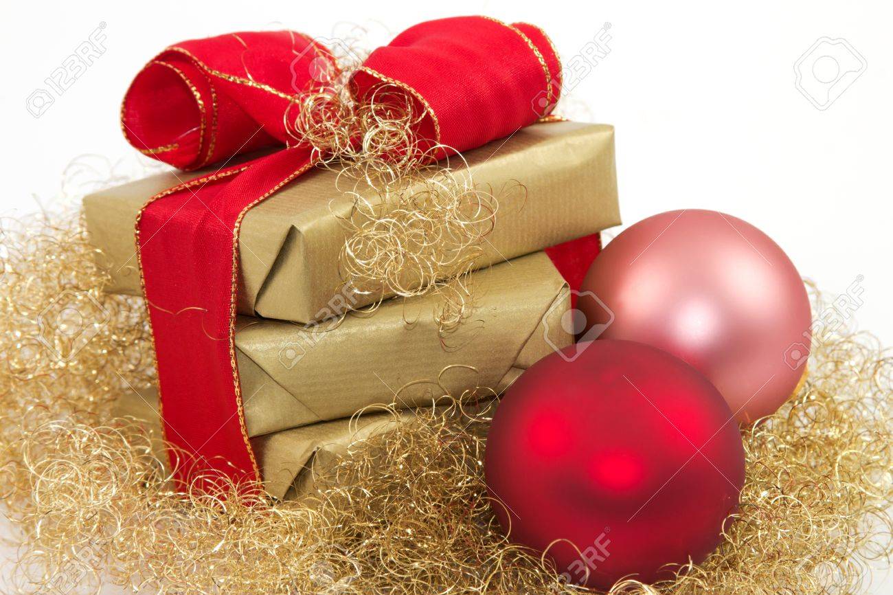 Three golden gifts and two Christmas balls with a white background - 11214516 Three golden gifts and two Christmas balls with a white background - 11214516