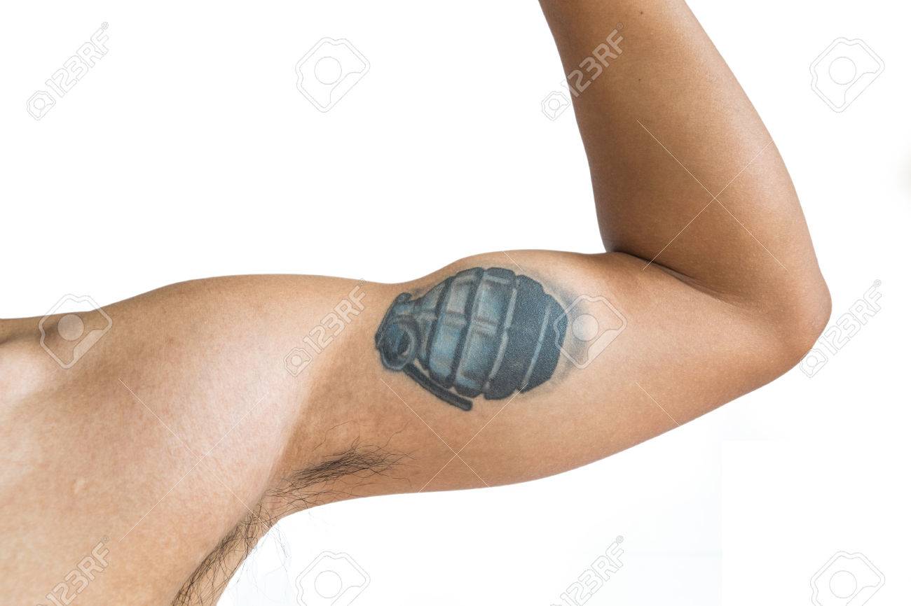 tan skin arm with portrait grenade tattoo isolated on white tan skin arm with portrait grenade tattoo isolated on white