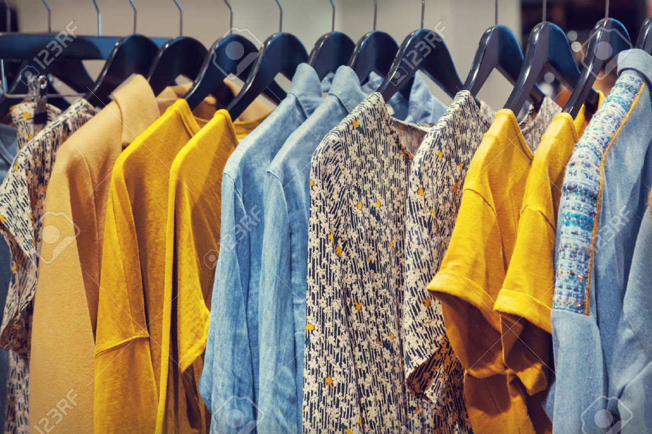 A row of clothes hanging on the rack - 44951285 A row of clothes hanging on the rack - 44951285