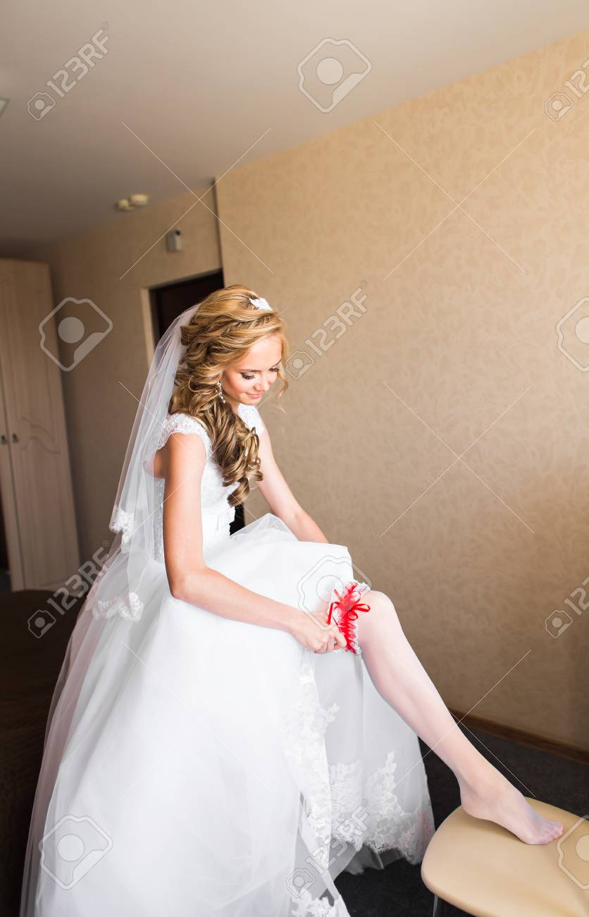 Bride Dresses Garter On The Leg Picture Of Beautiful Female Stock Photo Picture And Royalty Free Image Image 54293227