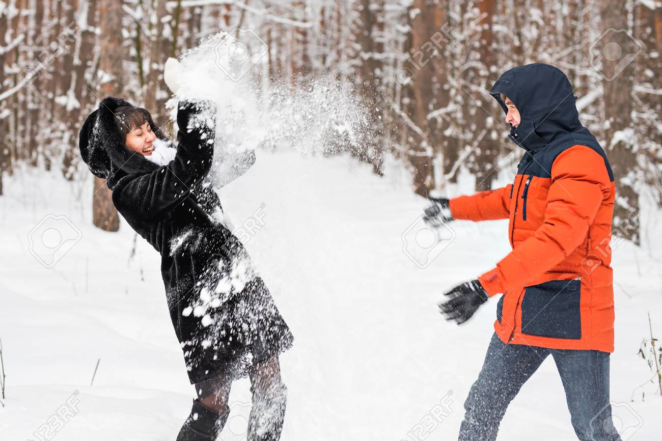 Young Couple Playing In Snow, Having Snowball Fight. Stock Photo, Picture  and Royalty Free Image. Image 65300176.