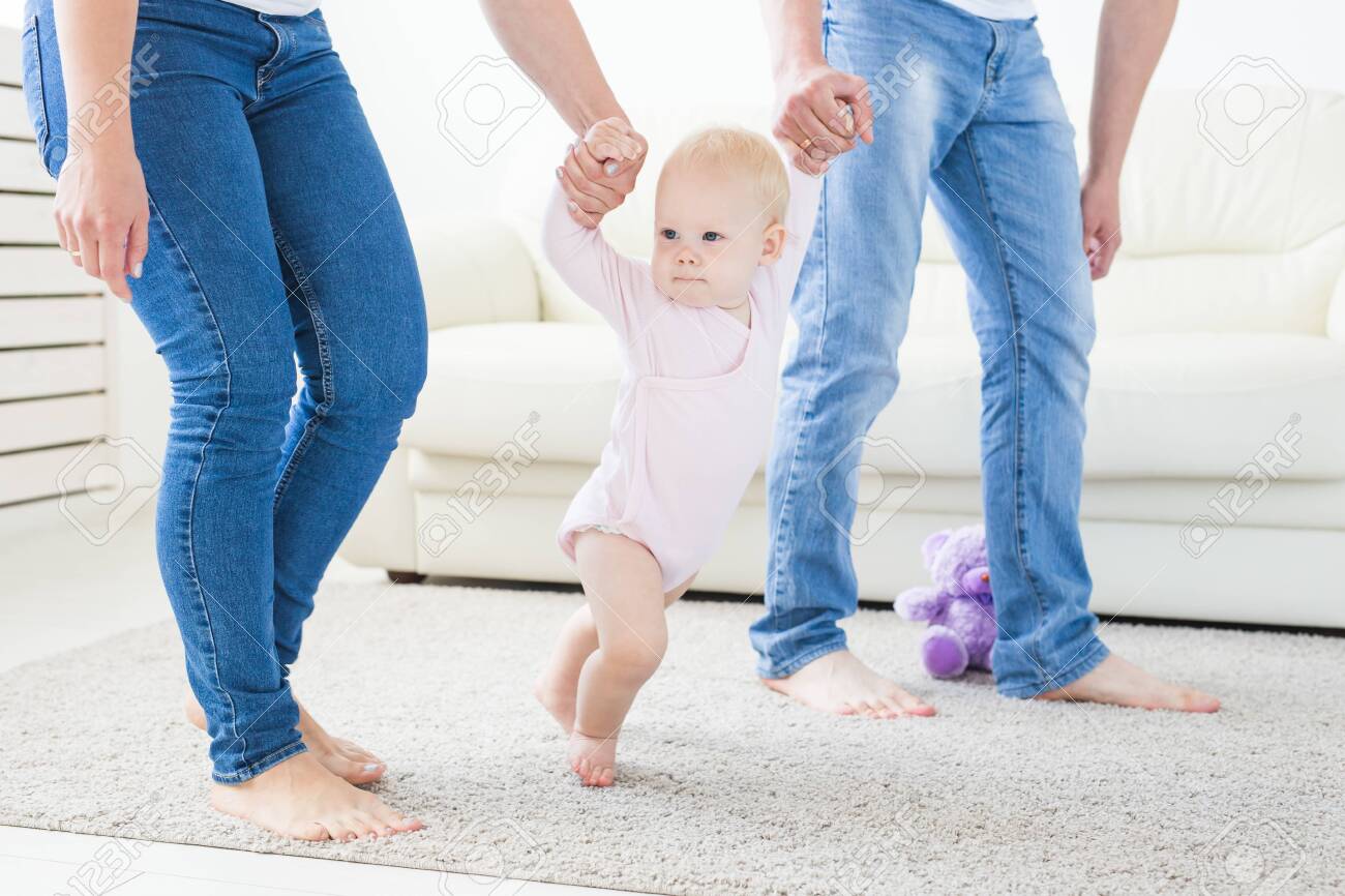 Family Children And Parenthood Concept Parents Teaching Baby