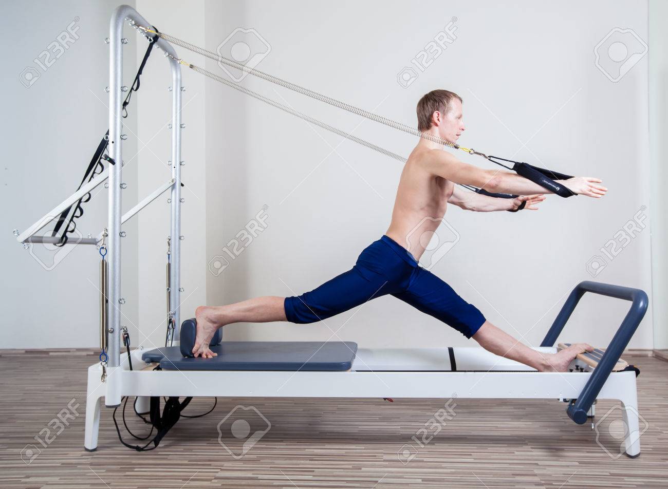 Pilates reformer workout exercises man at gym indoor - 40299167 Pilates reformer workout exercises man at gym indoor - 40299167