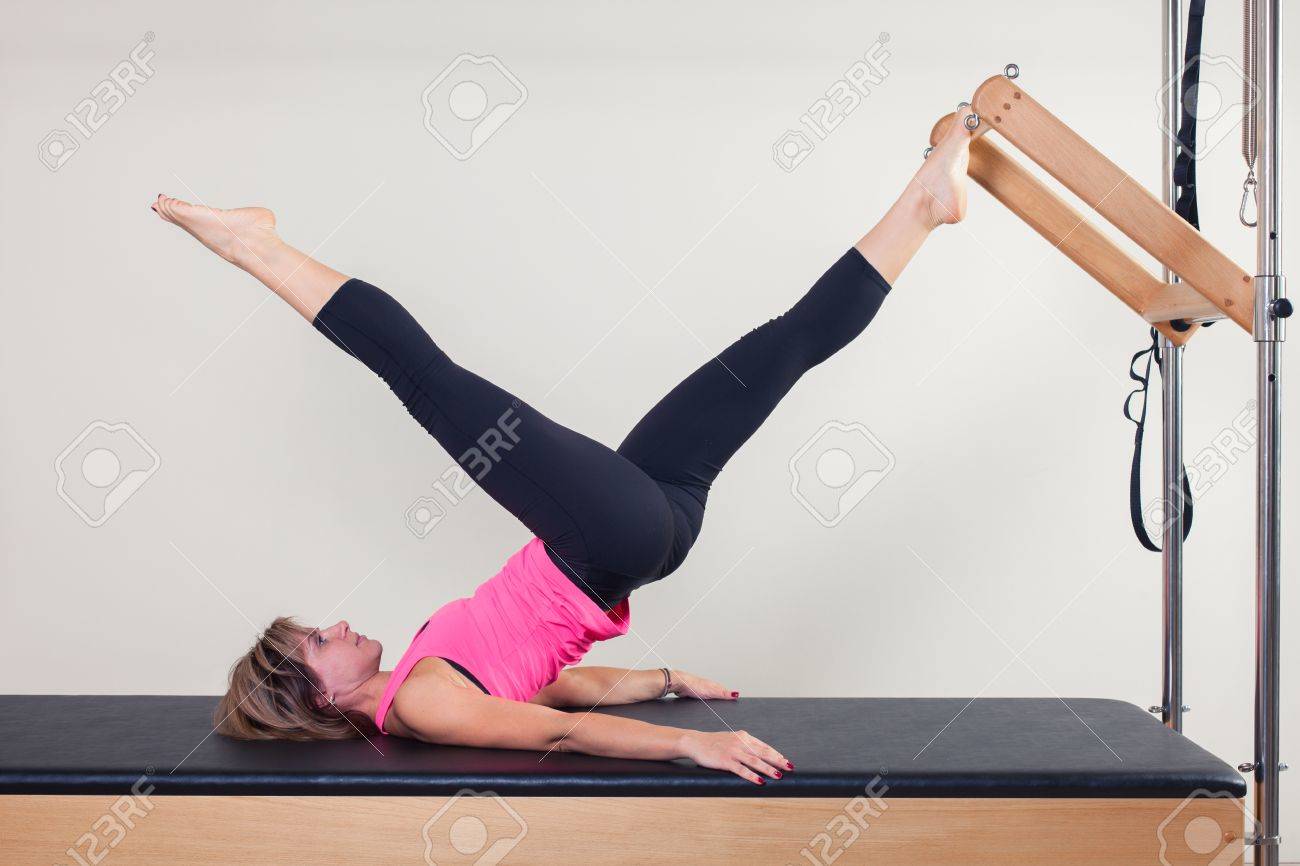 Pilates aerobic instructor woman in cadillac fitness exercise. - 48806258 Pilates aerobic instructor woman in cadillac fitness exercise. - 48806258