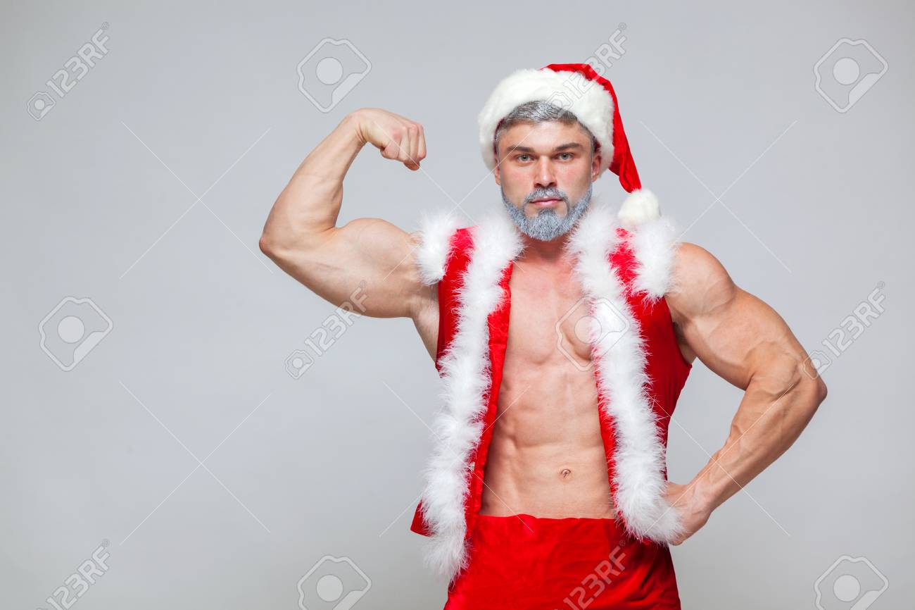 Un petit calendrier de l'Avent, ça vous dit ?! - Page 8 88300104-no%C3%ABl-sexy-p%C3%A8re-no%C3%ABl-jeune-homme-muscl%C3%A9-portant-un-chapeau-de-p%C3%A8re-no%C3%ABl-montre-ses-muscles-