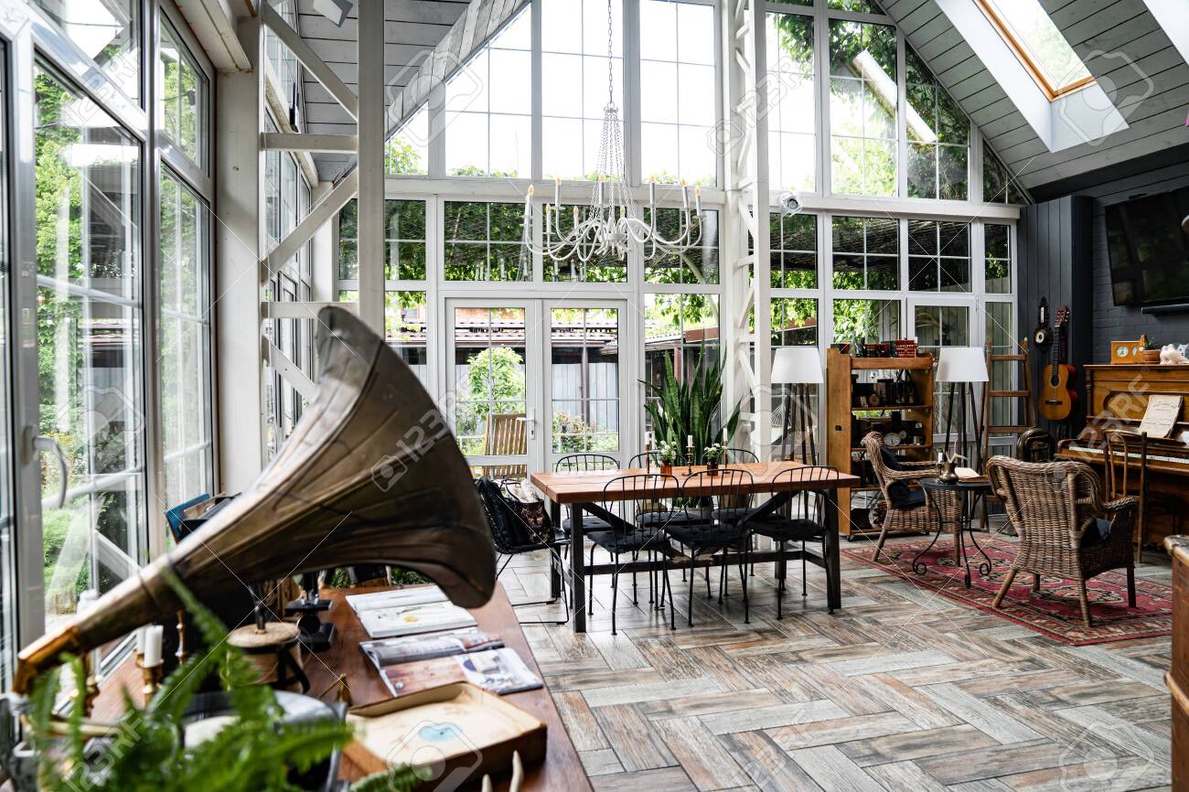 spacious, bright porch with large Windows. place for a family dinner or holiday. retro interior in the vintage style. - 150916200 spacious, bright porch with large Windows. place for a family dinner or holiday. retro interior in the vintage style. - 150916200