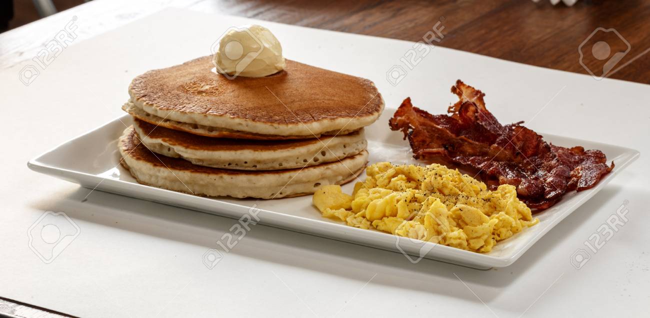 Three Pancakes With Bacon And Scrambled Eggs Stock Photo Picture And Royalty Free Image Image