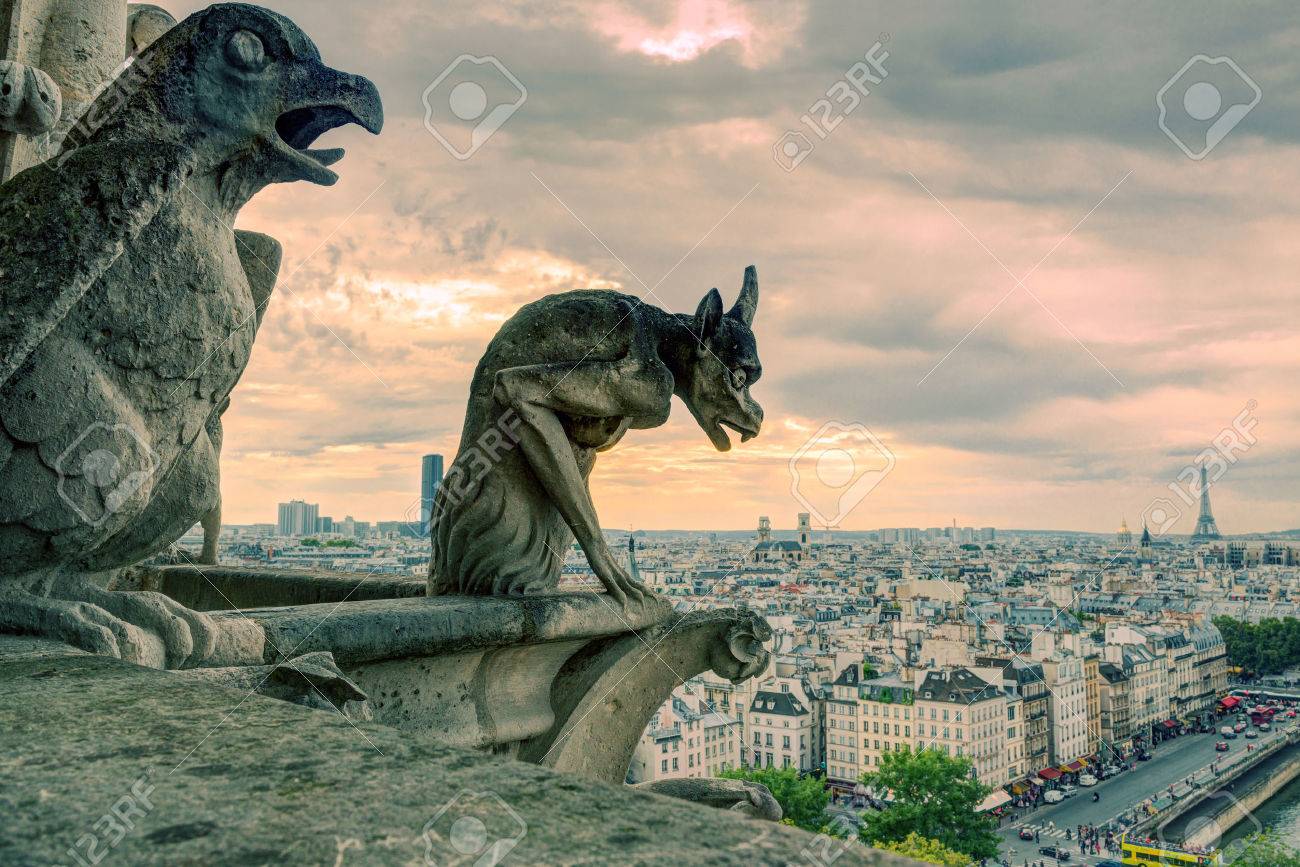 Chimeras gargoyle of the Cathedral of Notre Dame de Paris overlooking Paris, France - 24201037 Chimeras gargoyle of the Cathedral of Notre Dame de Paris overlooking Paris, France - 24201037