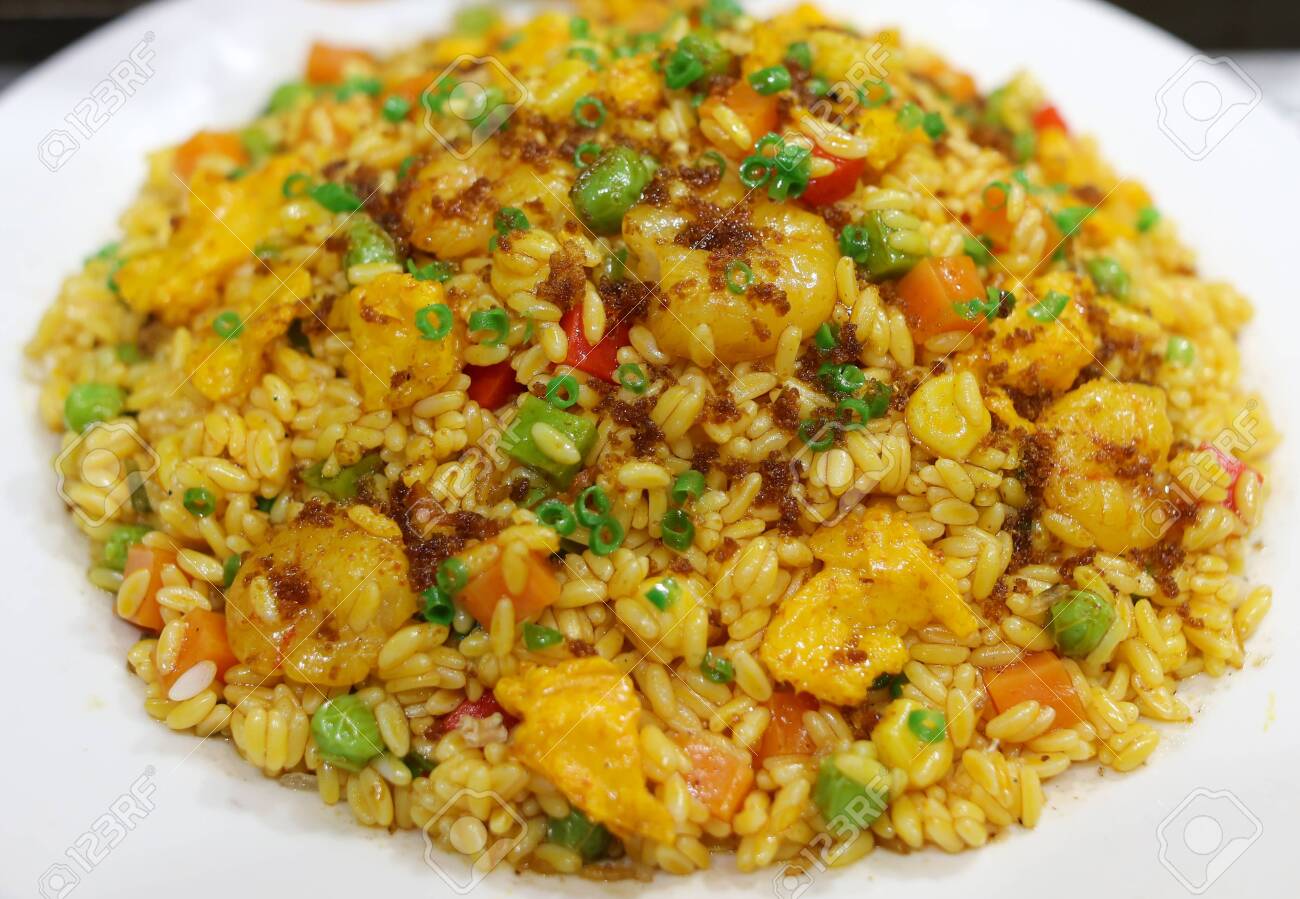 Rice cooked according to a special recipe. A dish of Chinese cuisine. - 142549928 Rice cooked according to a special recipe. A dish of Chinese cuisine. - 142549928
