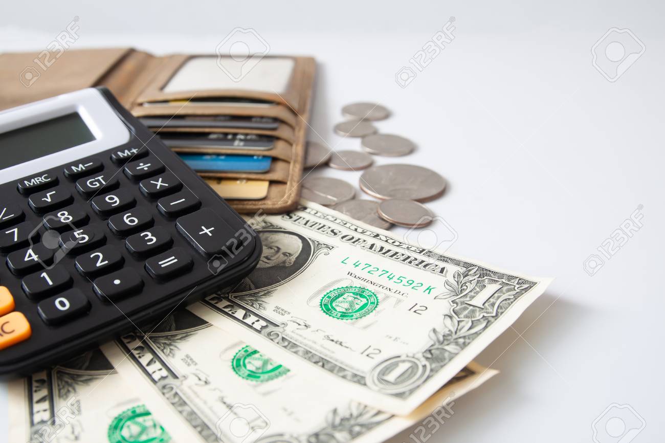 money purse with credit card and calculator on white table calculator credit card
