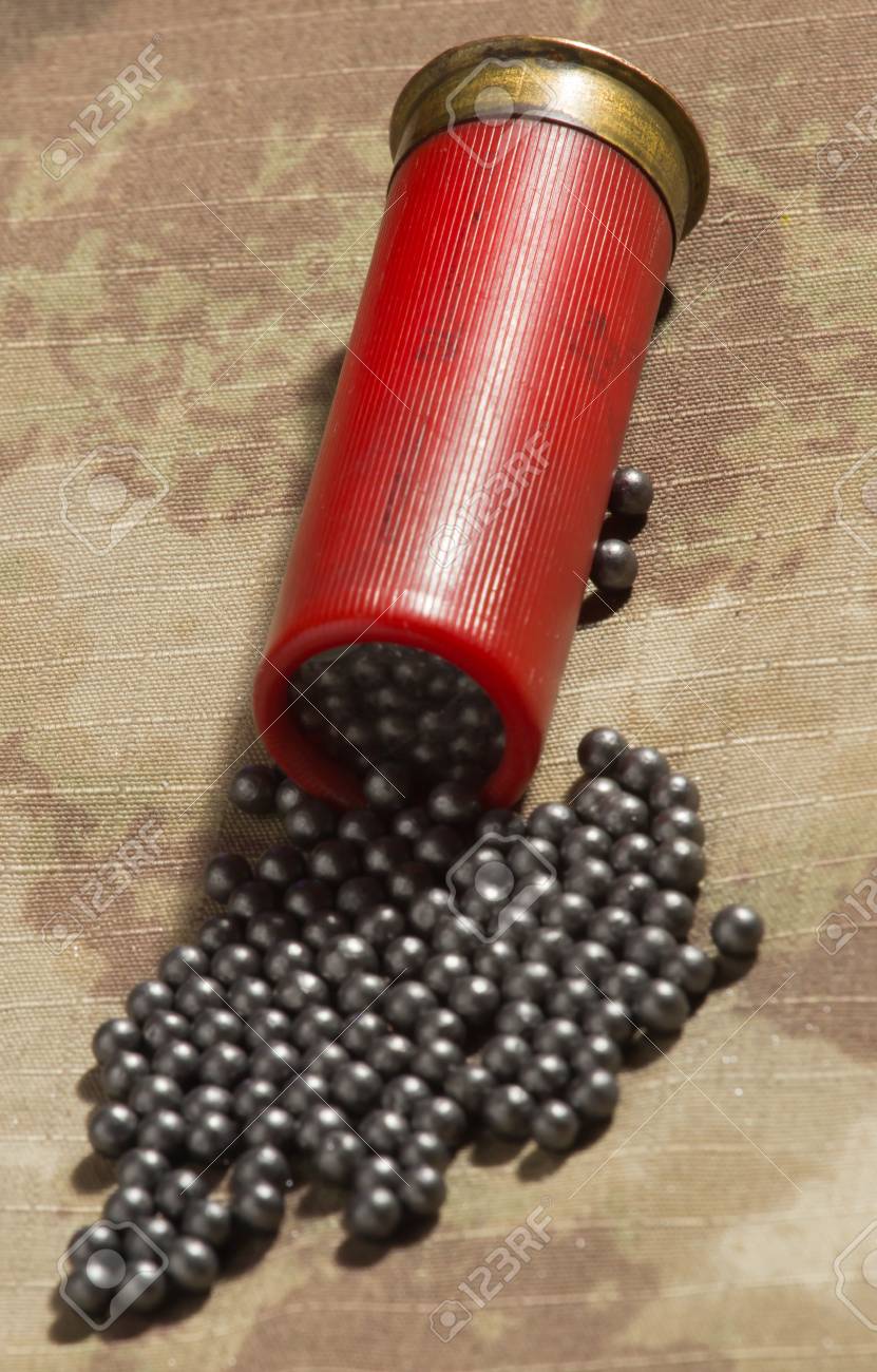 Hunting Cartridges And Lead Shot, Clouse Up. Camouflage Background Stock  Photo, Picture And Royalty Free Image. Image 48723738.