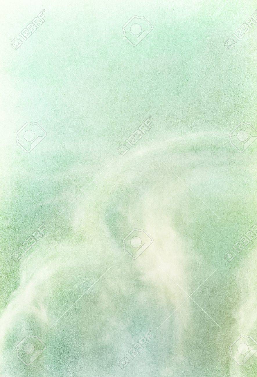 ethereal and wispy clouds on a textured vintage paper background wispy background