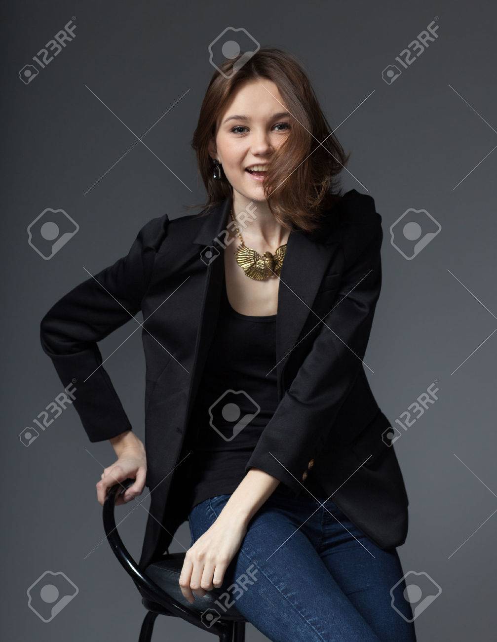 black blazer and blue jeans