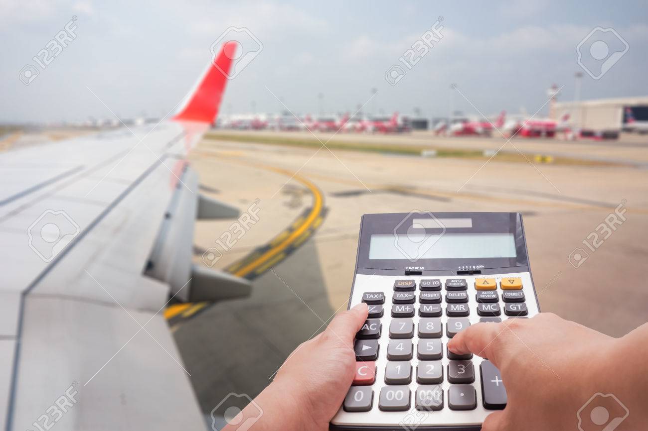 travel cost calculation concept by calculator and airplane in travel cost calculator