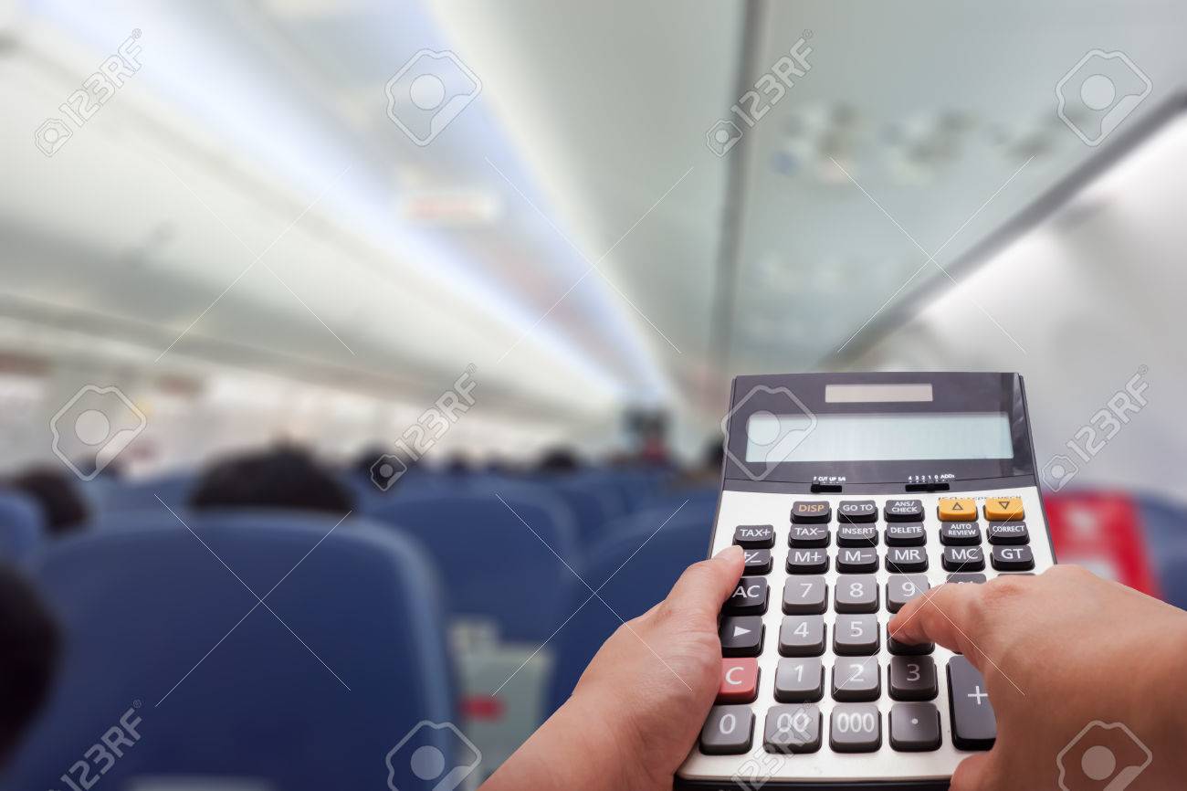 travel cost calculation concept by calculator and airplanes stock travel cost calculator