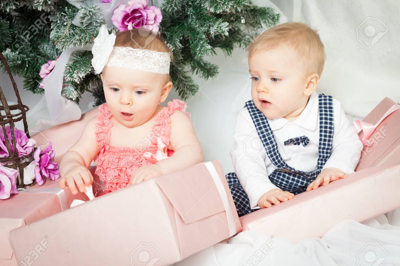 Little Baby Twins Boy And Girl With Christmas Tree And Gift Stock Photo Picture And Royalty Free Image Image
