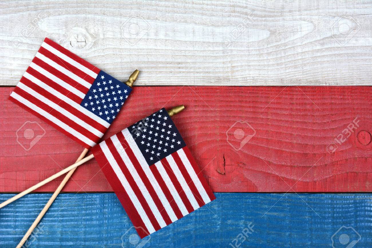 High angle shot of two crossed American flags on a red, white and blue picnic table. Horizontal format with copy space. - 36306567 High angle shot of two crossed American flags on a red, white and blue picnic table. Horizontal format with copy space. - 36306567
