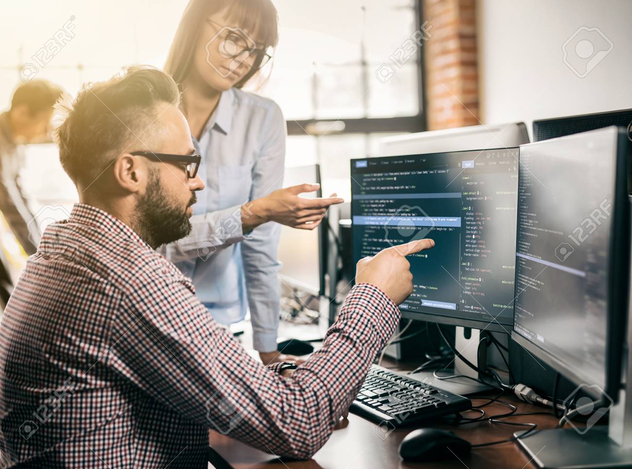 Developing programming and coding technologies. Website design. Programmer working in a software develop company office. - 93002395 Developing programming and coding technologies. Website design. Programmer working in a software develop company office. - 93002395