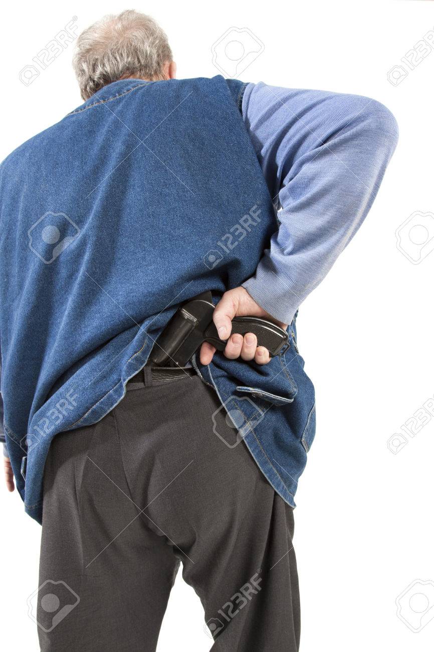 男がズボンの後ろに銃を隠す の写真素材 画像素材 Image