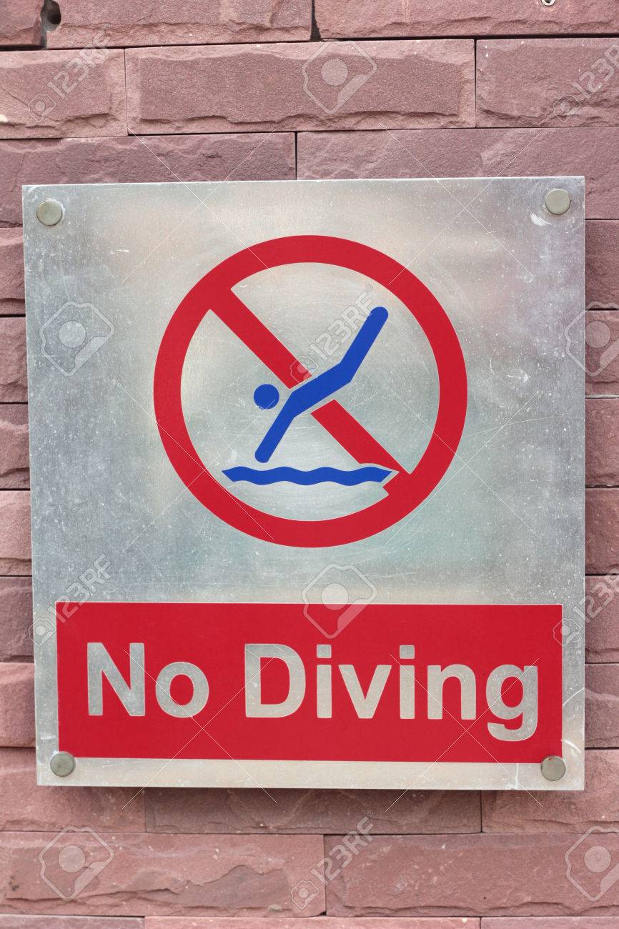 Prohibition Sign Jump Off Into The Pool On The Floor Stock Photo