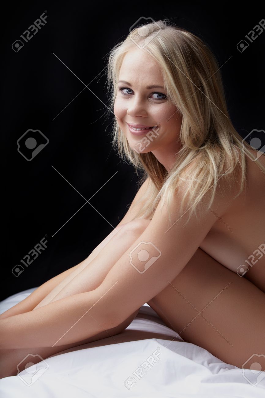 Nude Young Adult Caucasian Woman With Blonde Hair And Blue Eyes On A Dark  Background Stock Photo, Picture and Royalty Free Image. Image 11705949.