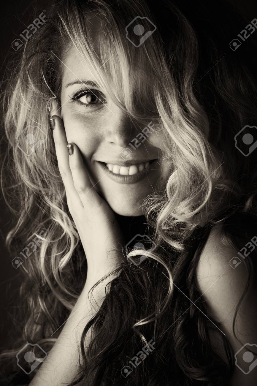 Beautiful Young Blonde Caucasian Woman With Long Curly Honey