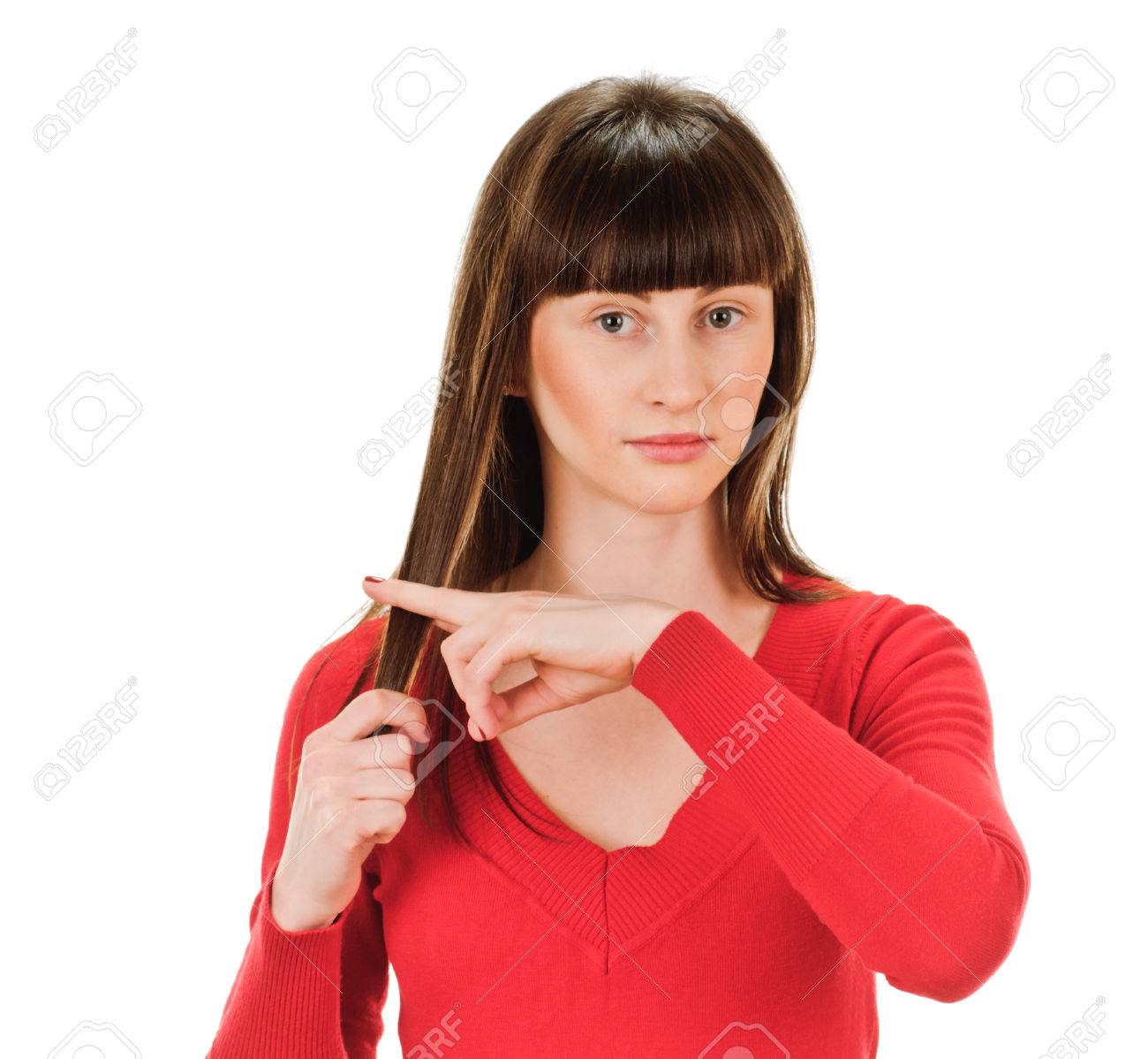 若い女性は 指で自分の髪を切っています 白い背景の上 の写真素材 画像素材 Image