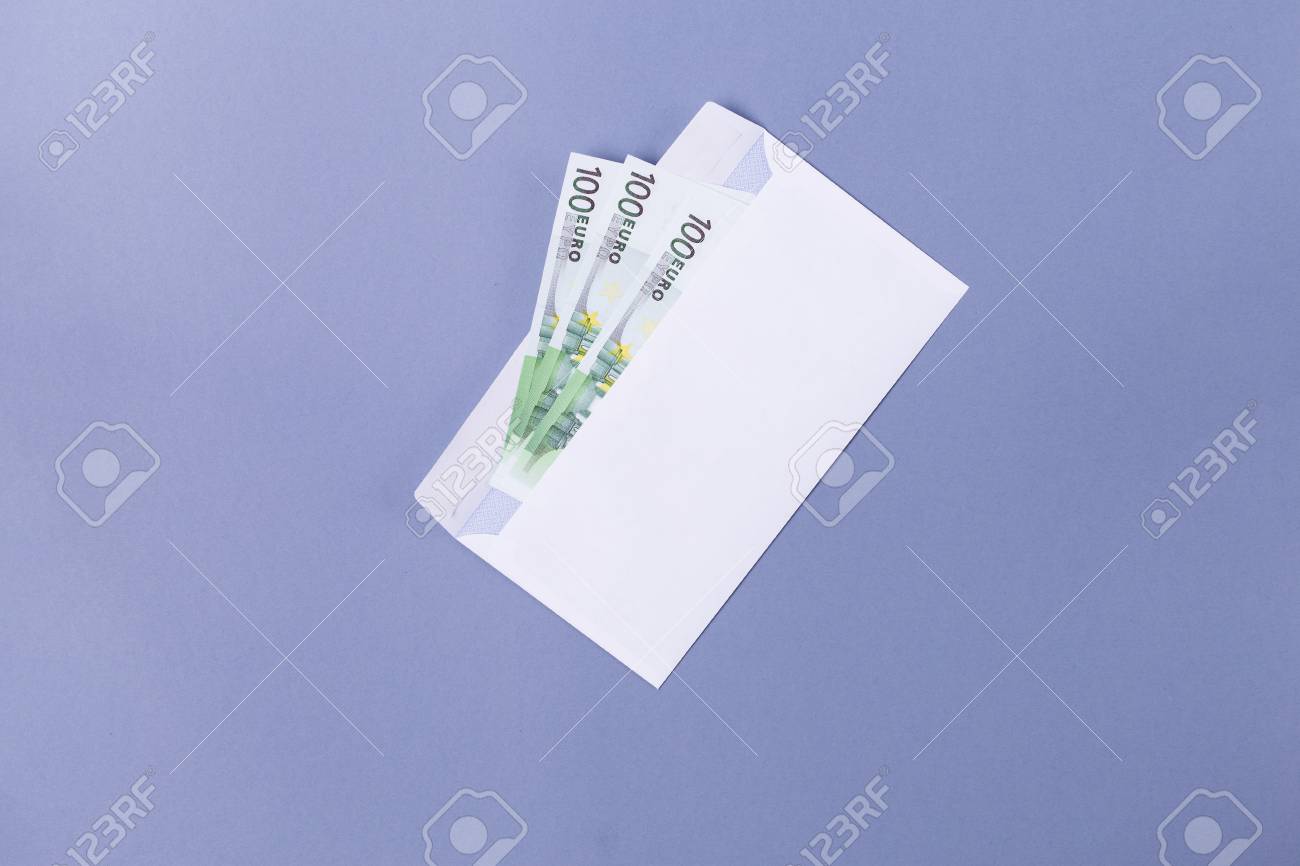 euro notes in an envelope on a blue background financial soncept