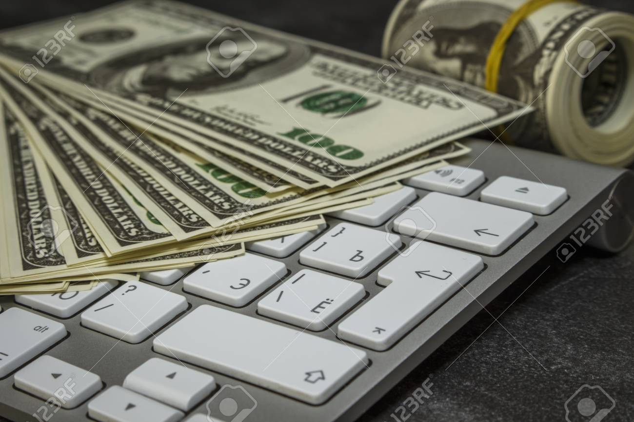 A Lot Of Money On A Computer Keyboard Stock Photo, Picture and Royalty Free  Image. Image 83348897., image size:1300x866