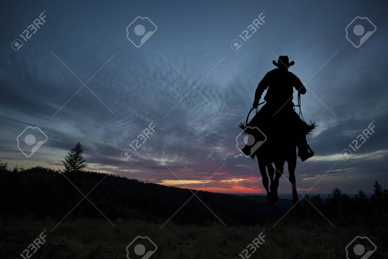 Cowboy silhouette on a horse during nice sunset - 64320404 Cowboy silhouette on a horse during nice sunset - 64320404