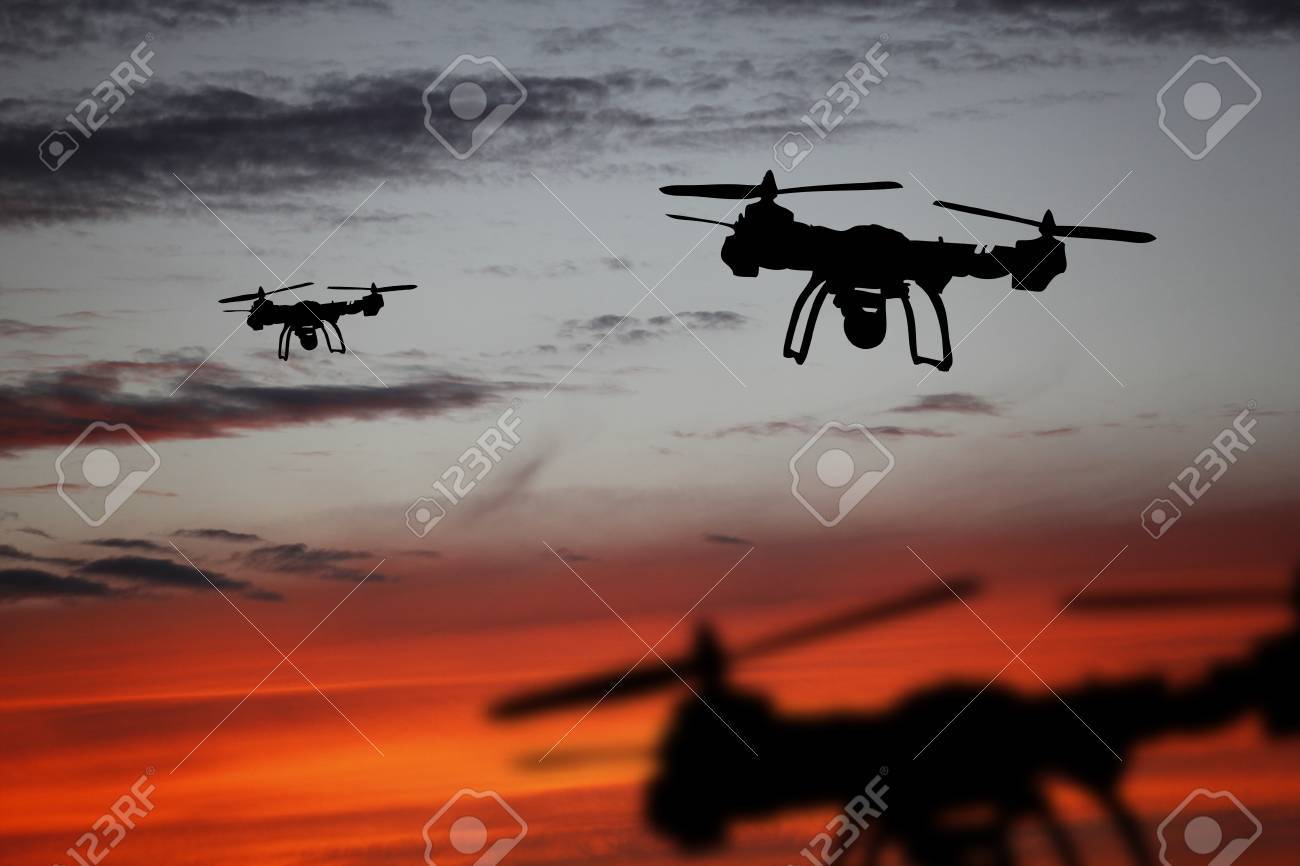 Innovation concept. Silhouette of drone flying on sunset. Heavy lift drone photographing at sunset. - 89224295 Innovation concept. Silhouette of drone flying on sunset. Heavy lift drone photographing at sunset. - 89224295