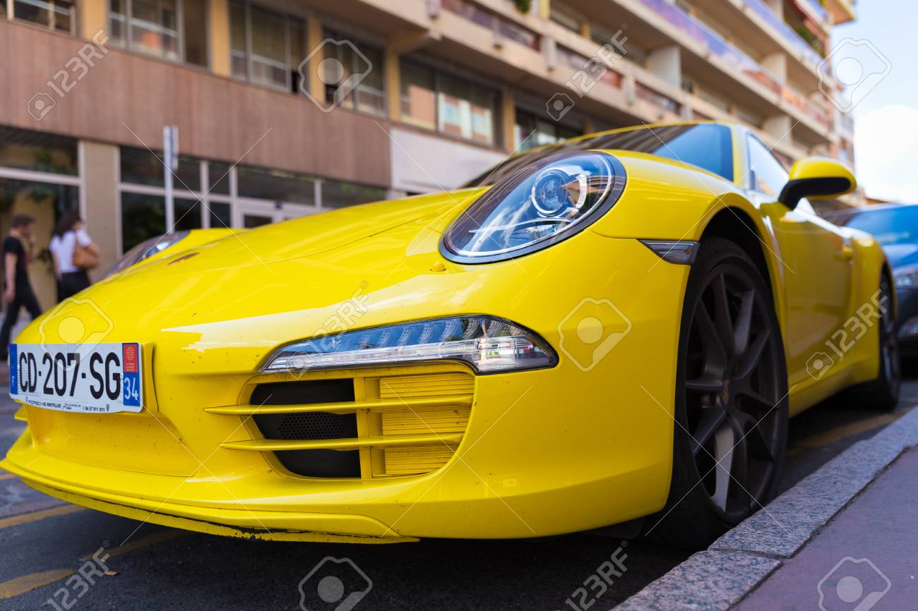 TOULOUSE, FRANCE , JULY 22, 2014 Parked bright yellow Porsche..