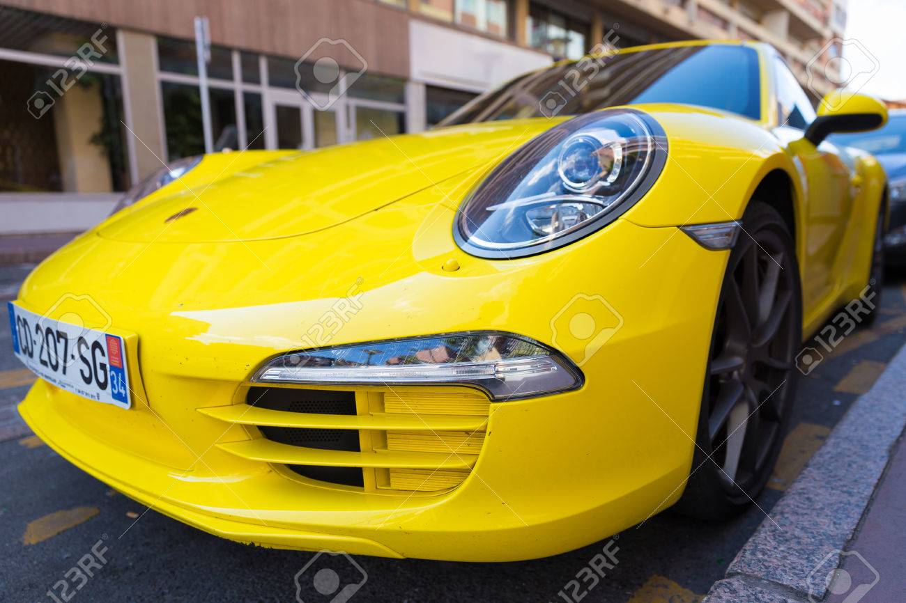 TOULOUSE, FRANCE , JULY 22, 2014 Parked bright yellow Porsche..