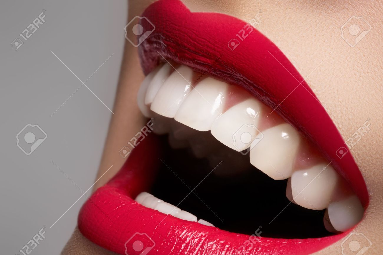 Close-up happy female smile with healthy white teeth, bright magenta lips make-up. Cosmetology, dentistry and beauty care. Macro of woman's smiling mouth - 11713907 Close-up happy female smile with healthy white teeth, bright magenta lips make-up. Cosmetology, dentistry and beauty care. Macro of woman's smiling mouth - 11713907