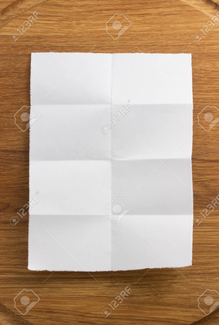 folded note paper on wooden background stock photo picture and