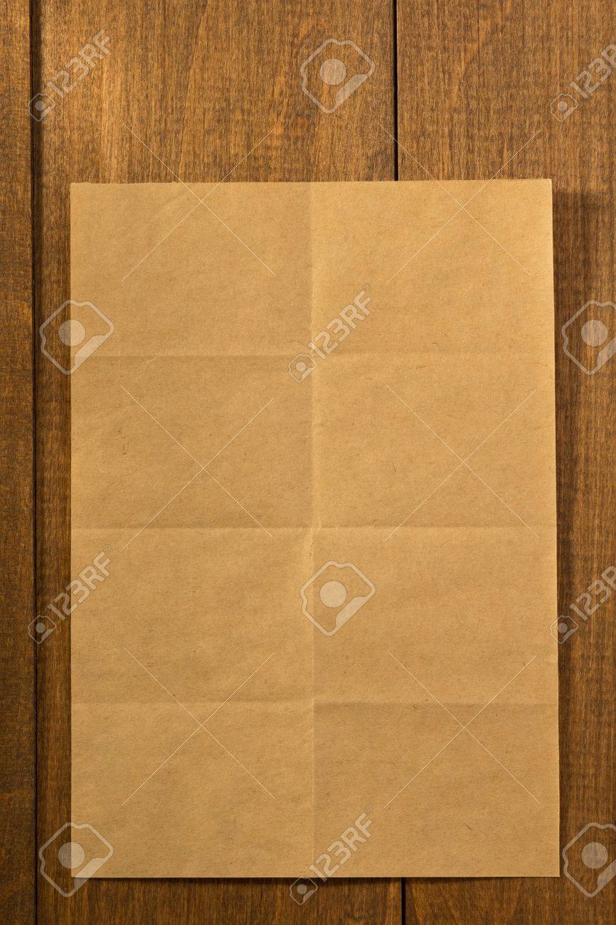 folded note paper on wooden background stock photo picture and