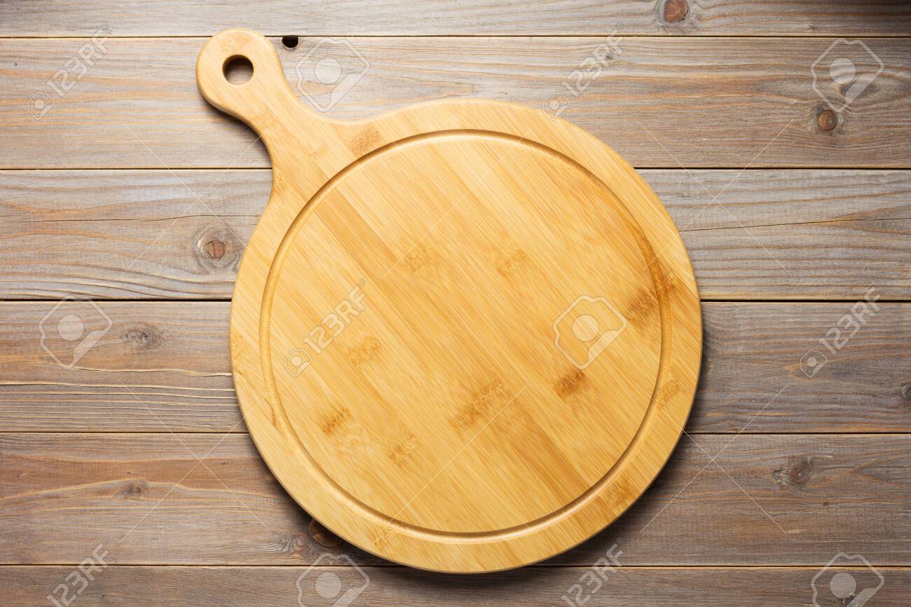 cutting pizza board at wooden plank table board background, top view - 131604706 cutting pizza board at wooden plank table board background, top view - 131604706