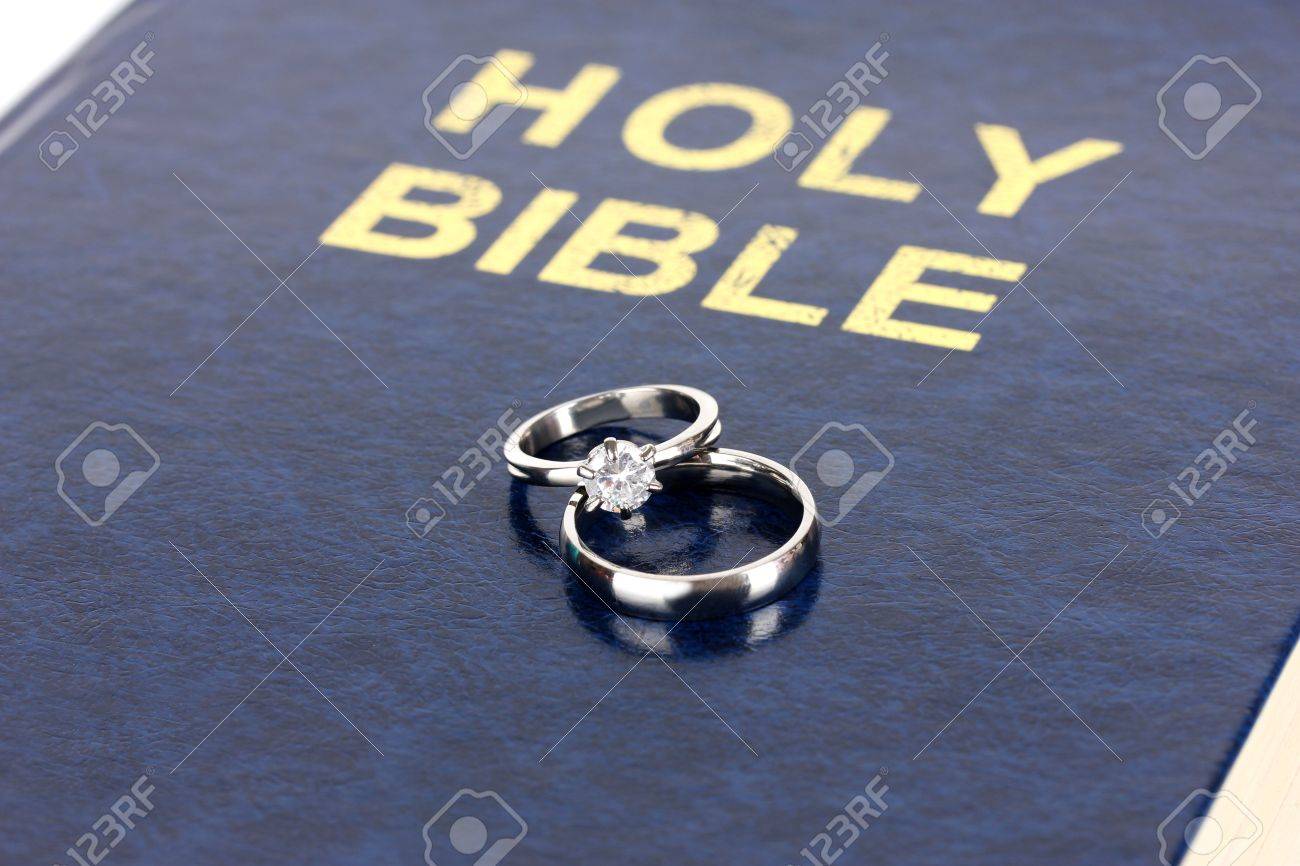 wedding rings on bible stock photo picture and royalty free image