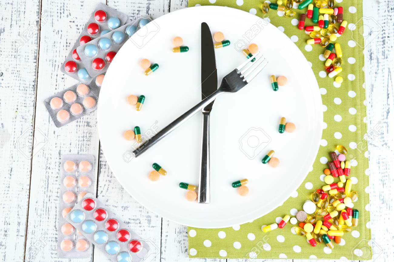medication schedule and meals conceptual photo on color napkin meals schedule