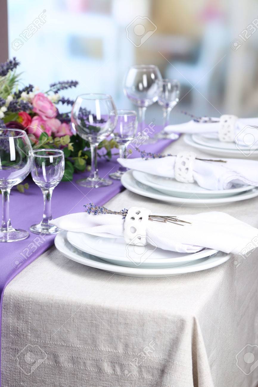 Dinner Table Background dining table setting with lavender flowers on table, on bright Dinner Table Background dining table setting with lavender flowers on table, on bright