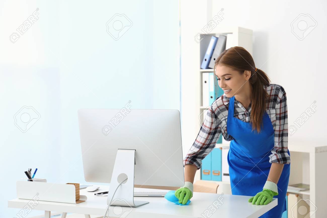 Cleaning Concept. Young Woman Cleaning Office Stock Photo, Picture ...