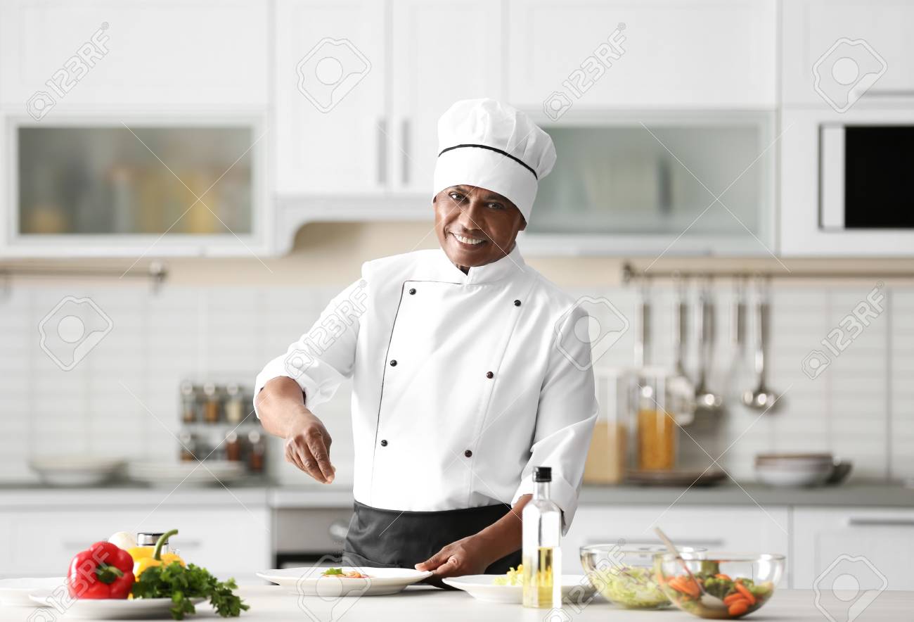Mature Indian Chef Cooking In Kitchen Stock Photo Picture And Royalty Free Image Image 110102174