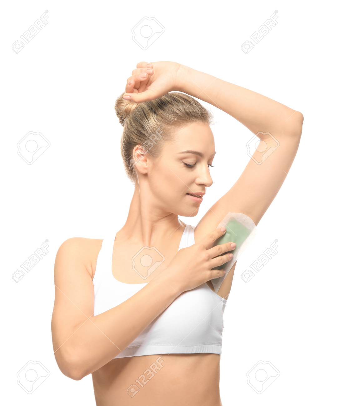 Beautiful Young Woman Removing Hair From Armpits Using Wax Strip