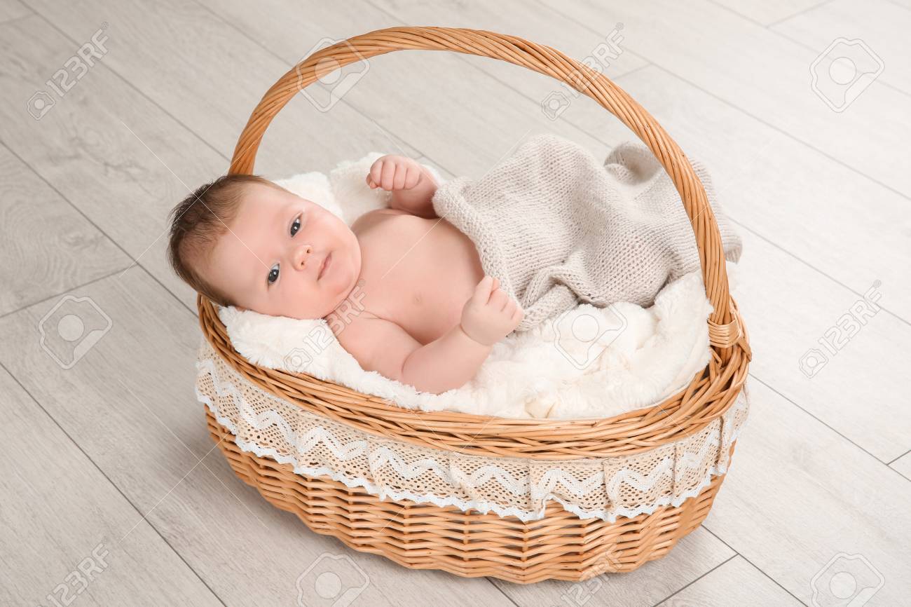 newborn in basket