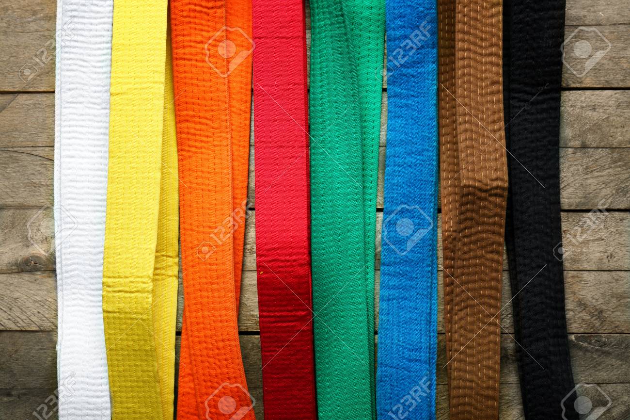 Colorful Karate Belts On Wooden Background Stock Photo, Picture and Royalty  Free Image. Image 113505336.