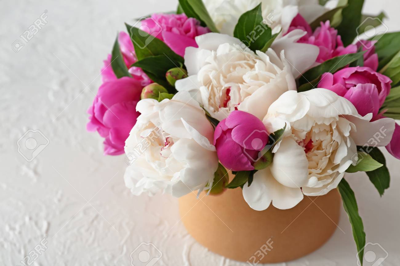 Box With Beautiful Peony Flowers On White Table Stock Photo Picture And Royalty Free Image Image 114688799