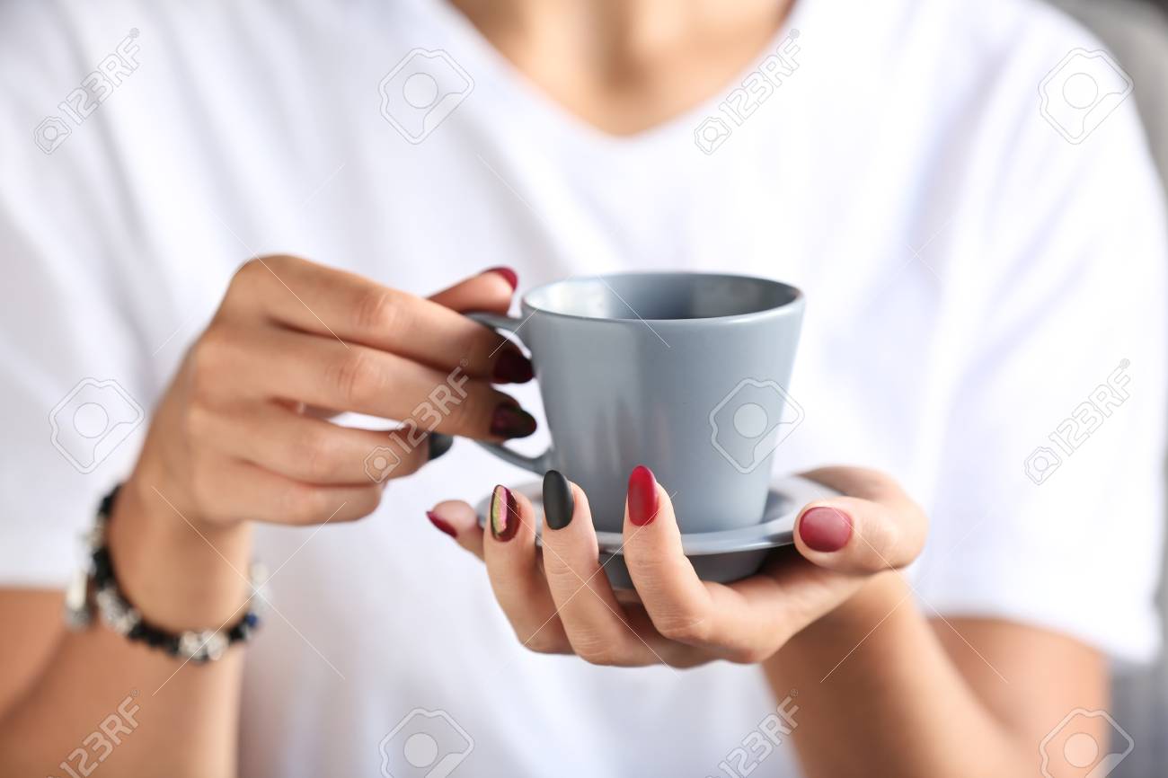 Woman with stylish beautiful manicure drinking coffee, closeup - 116095686 Woman with stylish beautiful manicure drinking coffee, closeup - 116095686