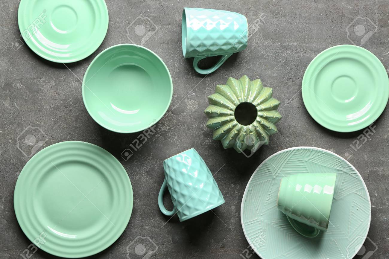 Tableware and decorative vase on grey background - 115550314 Tableware and decorative vase on grey background - 115550314